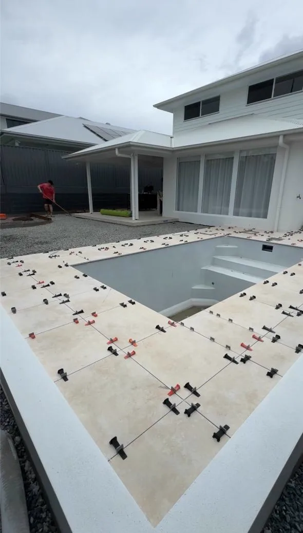 Excavator digging out the pool shell during pool excavation on a Gold Coast property